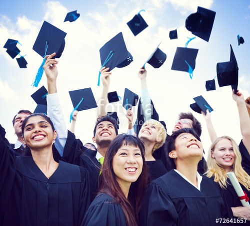 Student's throwing their hats in the air.